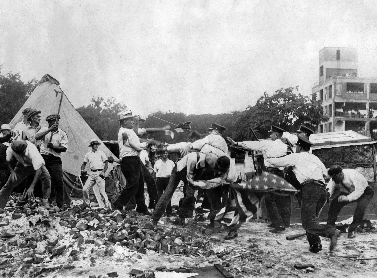 Vintage photo of protestors fighting the police.