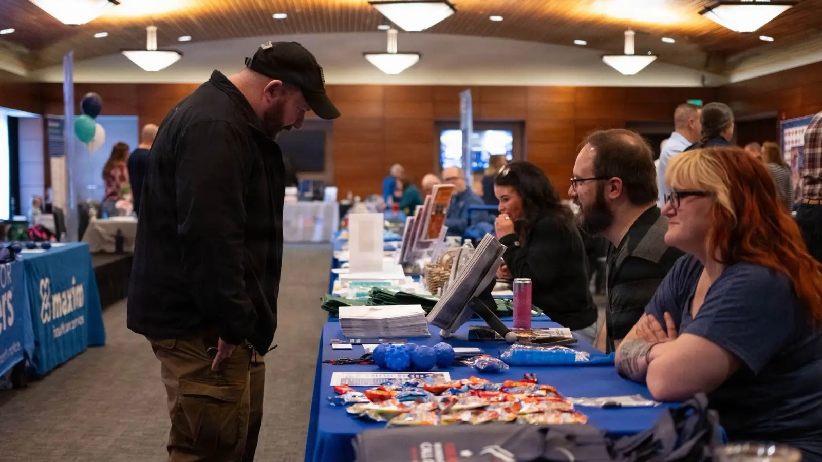 Veteran looks at brochures at a job fair.