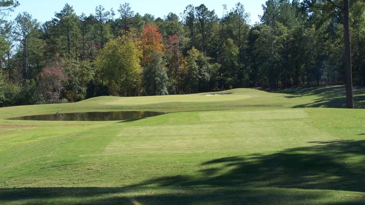 Wide view of a golf course.