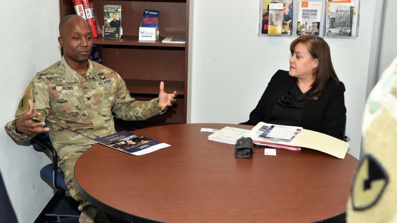 U.S. Army COL Brian Jacobs, Fort Hamilton Garrison Commander receives an education brief from Angela Diaz, Assistant Dean for Military Advertisement, St. Joseph's College at the Ft Hamilton Army Education Center on January 19th, 2023.