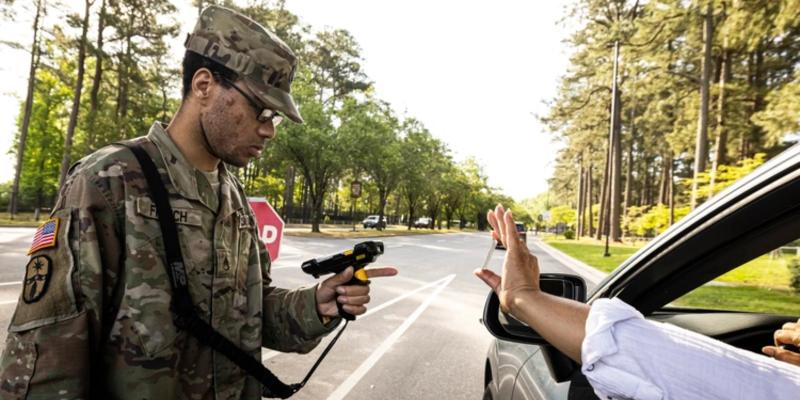 U.S. Army Staff Sgt. Kadeem French, a section chief for the 54th Quartermaster Company (Mortuary Affairs) out of Fort Gregg-Adams, Va., scans an identification card April 25, 2025, at the Gregg Gate, Fort Gregg-Adams.