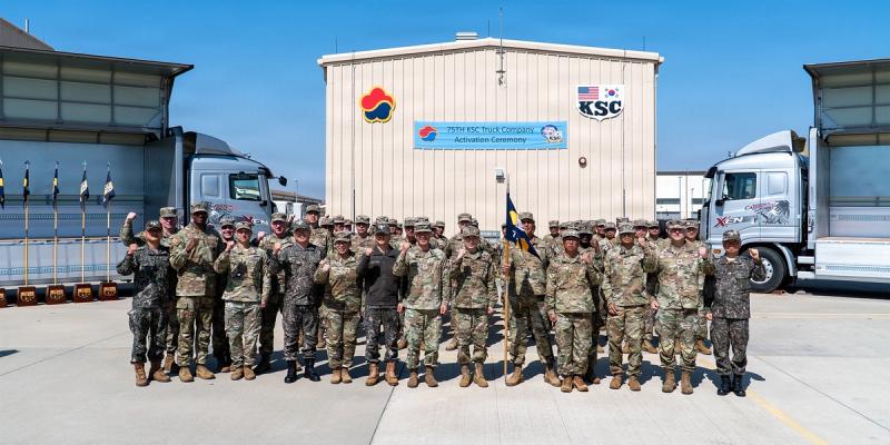 Personnel of the 19th Expeditionary Sustainment Command (ESC), 35th Air Defense Artillery and Korean Service Corps (KSC) gather for a group photo at the conclusion of the 75th Korean Service Corps Truck Company activation ceremony at Camp Humphrey, South Korea, April 8, 2026.