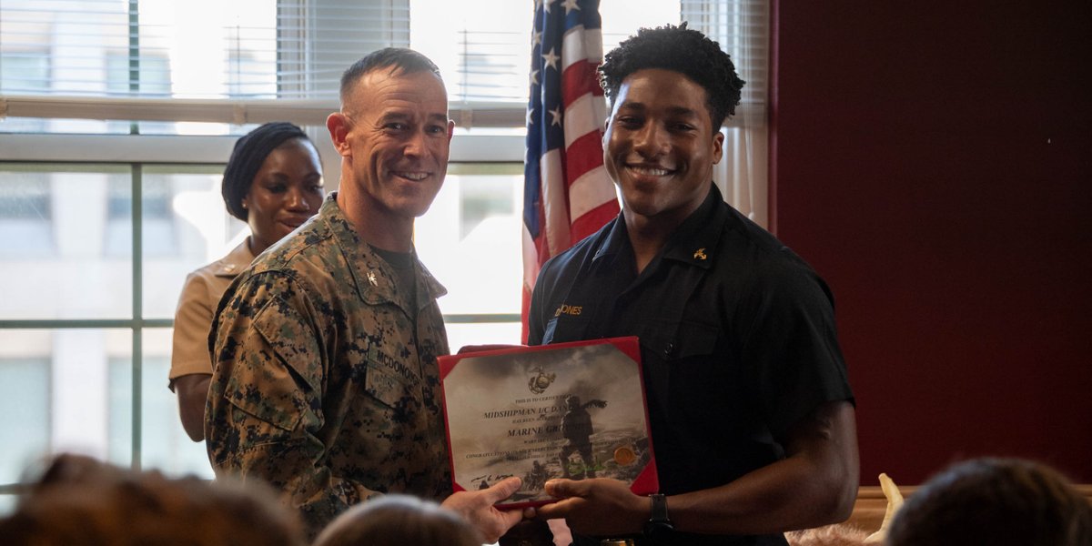 U.S. Naval Academy Commandant of Midshipmen Col. James P. McDounough celebrates with the class of 2024 midshipmen from the 3rd Company receiving their service assignment.