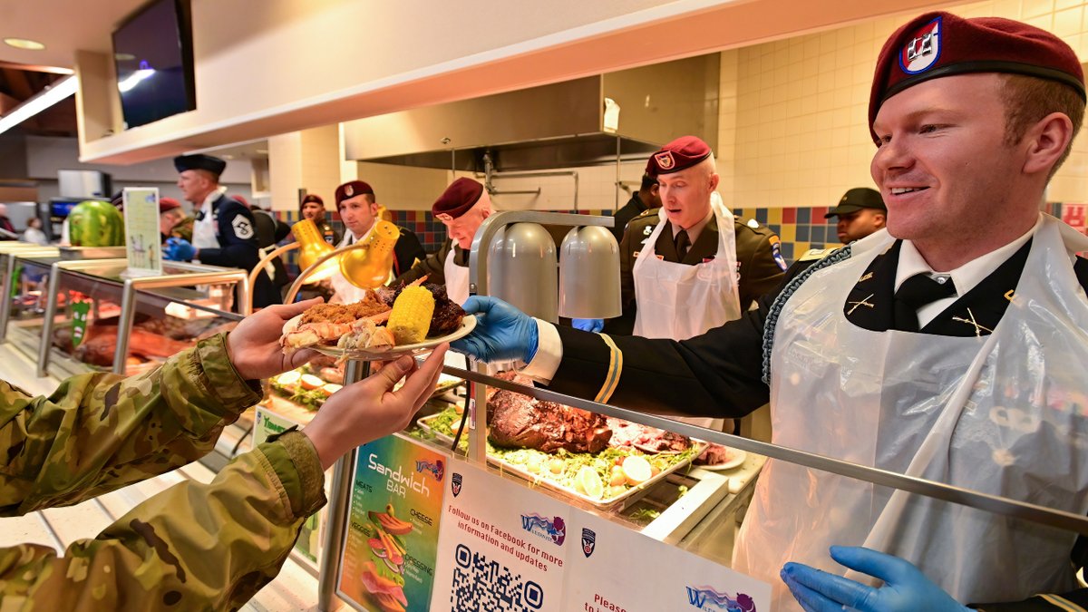 Capt. Grant Lockwood hands over a hefty plate during an early Thanksgiving meal for service members and families, Department of Defense civilian workers and military retirees at the Wilderness Inn, Nov. 26, at Joint Base Elmendorf-Richardson.
