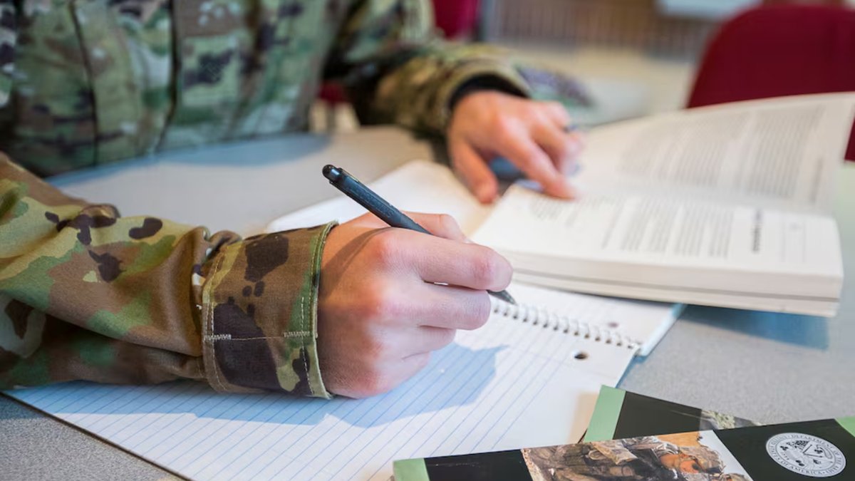A service member completes a school assignment at Joint Base Myer-Henderson Hall Education Center. (Nell King/DoD)