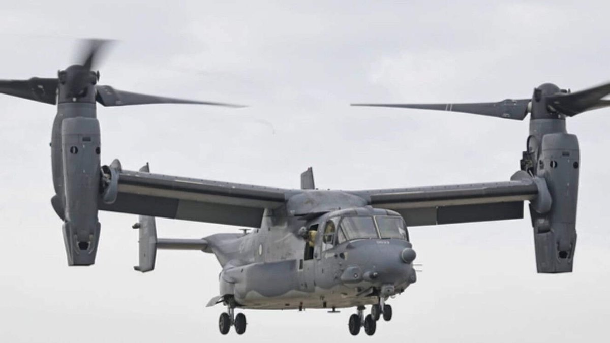 V-22 Osprey aircraft in flight against cloudy sky in Japan.