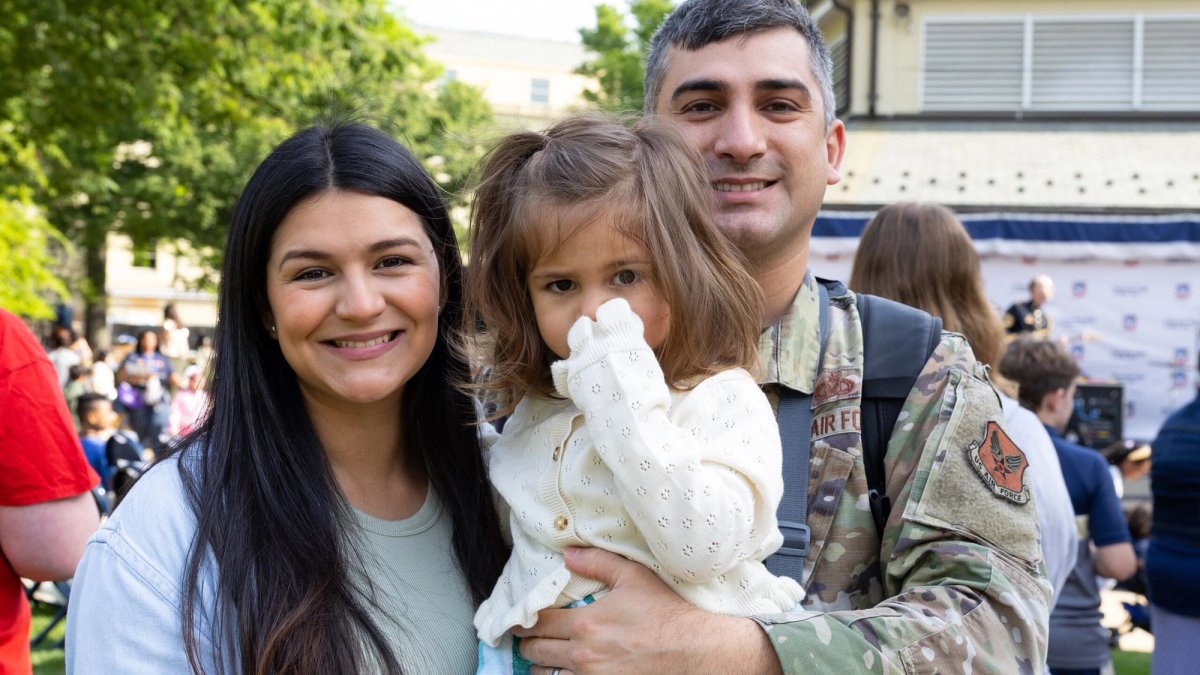 Portrait of a military family of three.