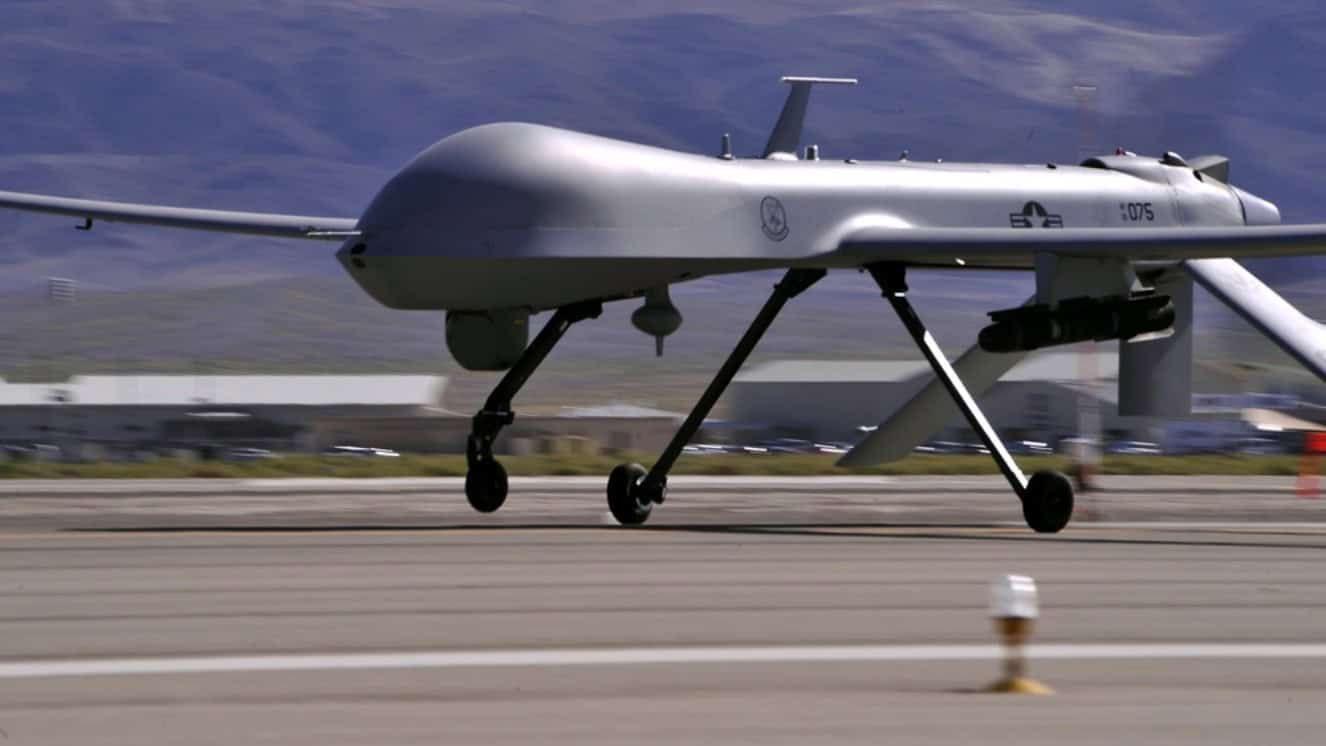 MQ-1 Predator drone taxiing on military airfield runway