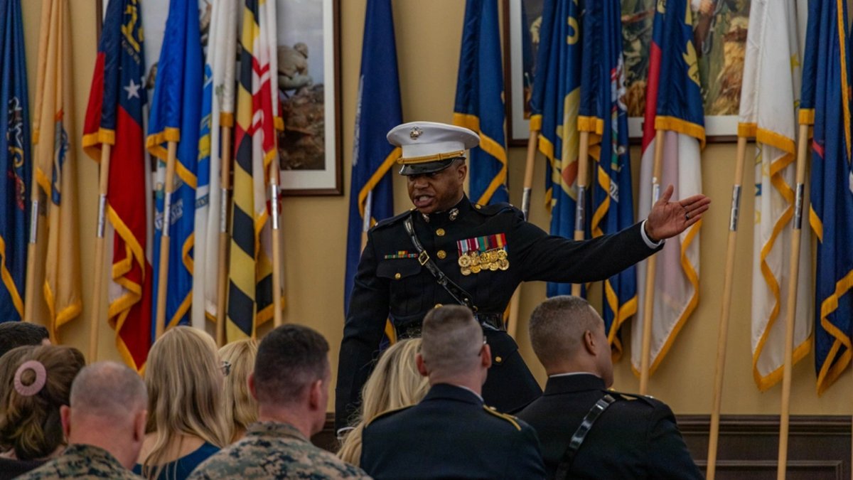 U.S. Marines Corps Chief Warrant Officer 3 Todd Cross, an operations chief, recites “The Watch” during Chief Warrant Officer 5 Andrew Lutz’s retirement ceremony on Marine Corps Base Quantico, Virginia, Oct. 10, 2025.