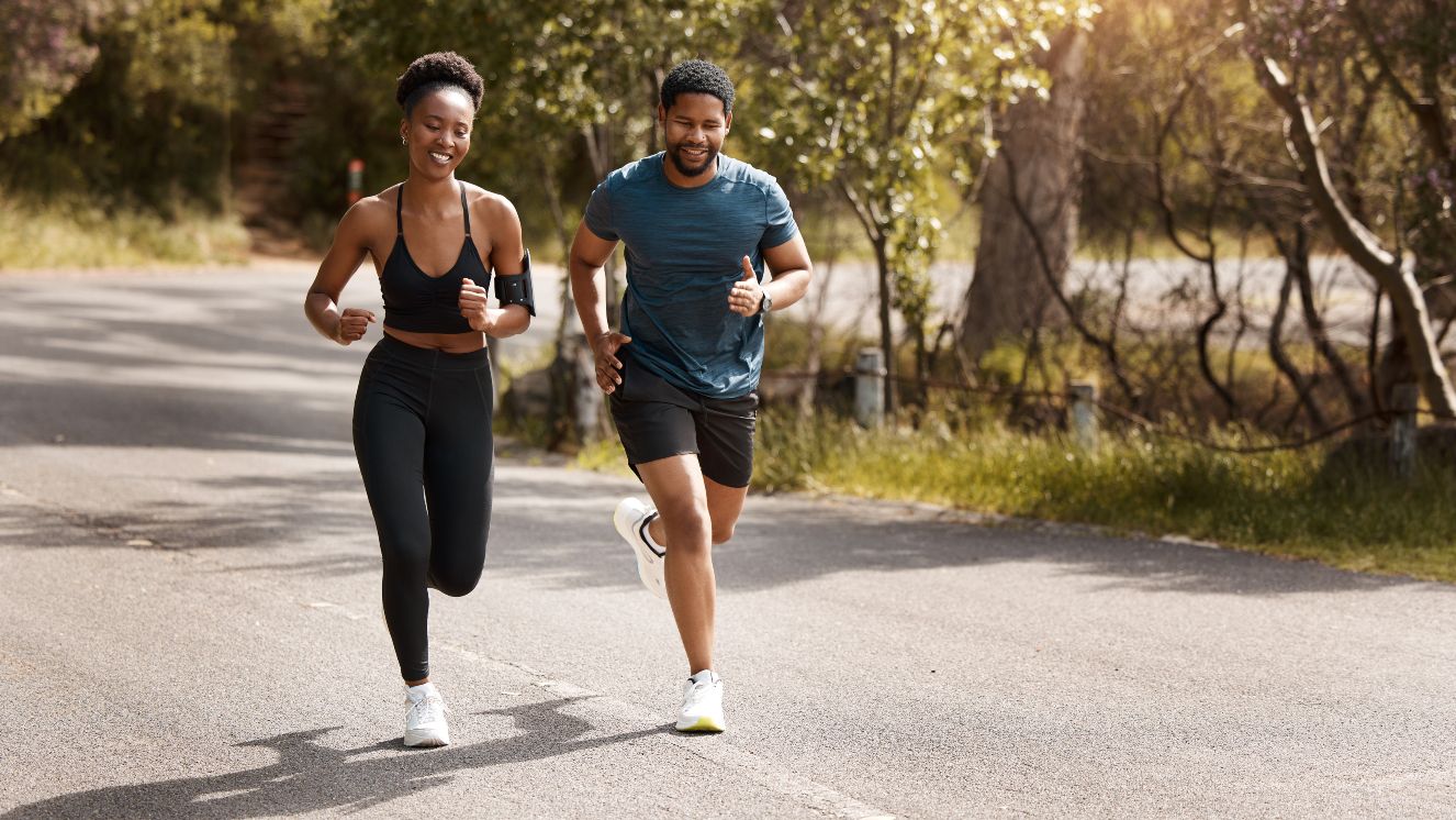 A couple going on a run together, supporting each other's mental and physical health journey.