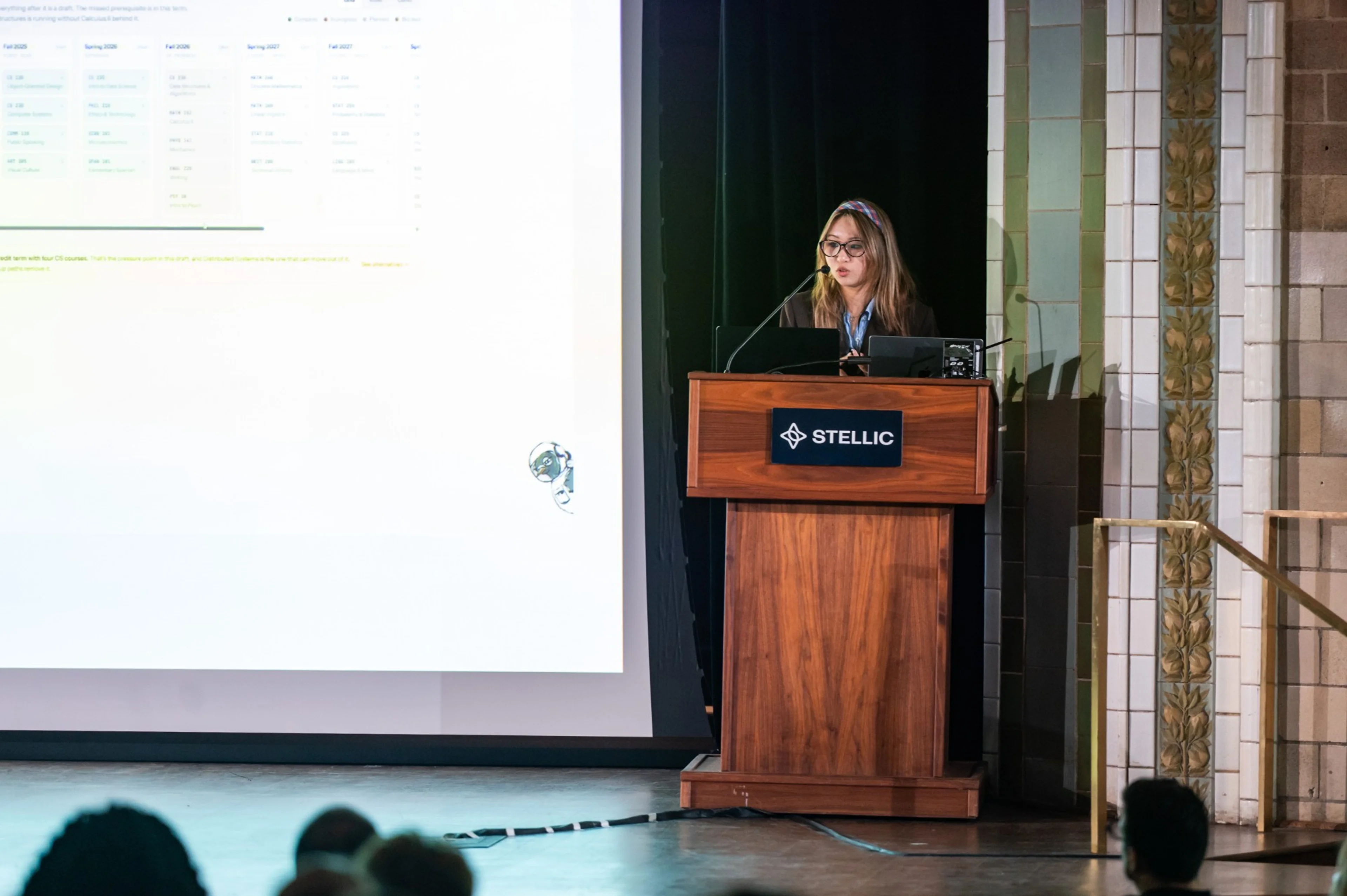 A Flightplan finalist presenting on stage at Stellic Summit