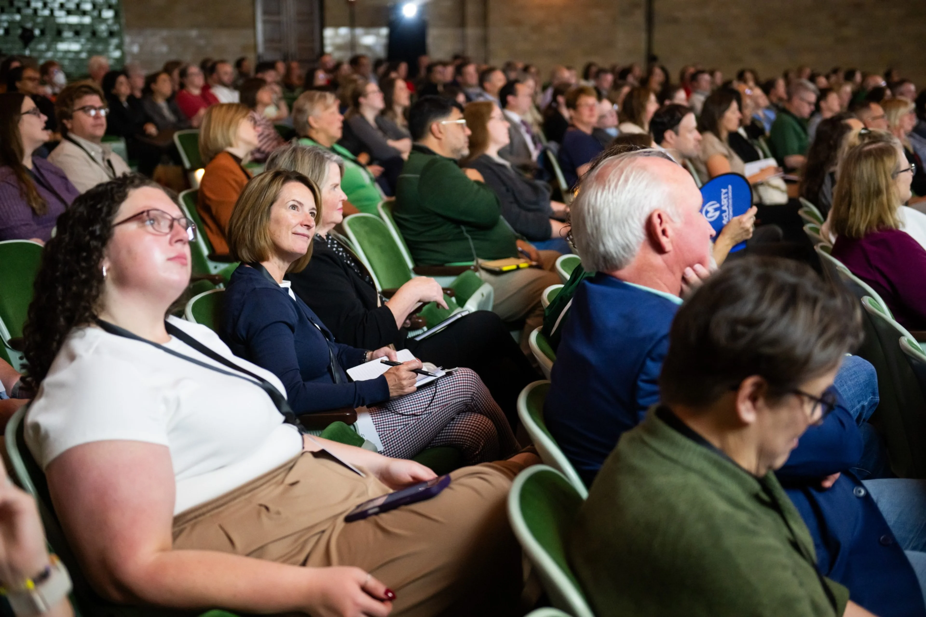 Summit attendees watching the finalist presentations
