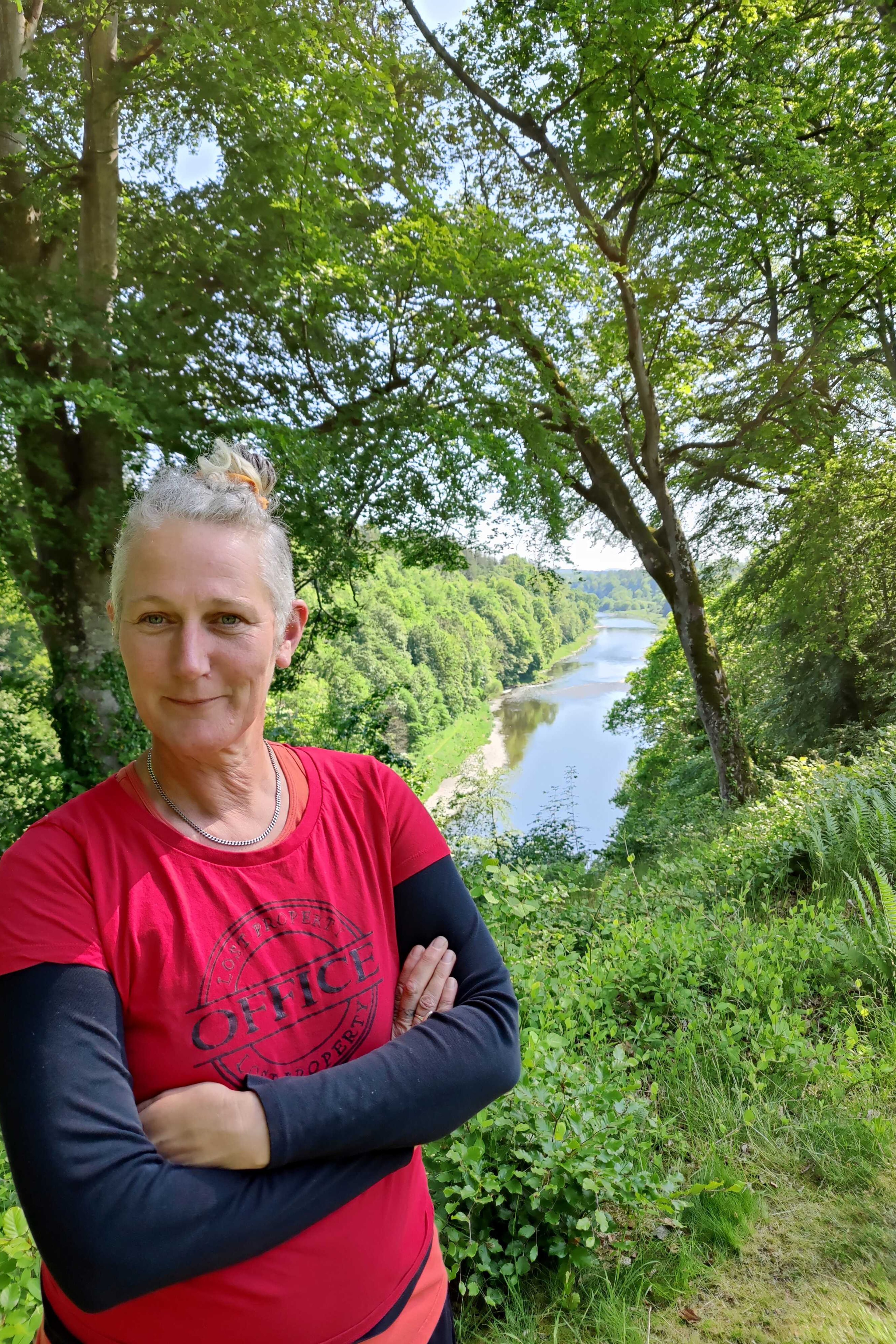A woman stood beside the River Tweed