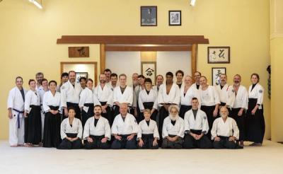 Group photo of Tenzan Aikido advanced seminar participants in front of the shomen altar
