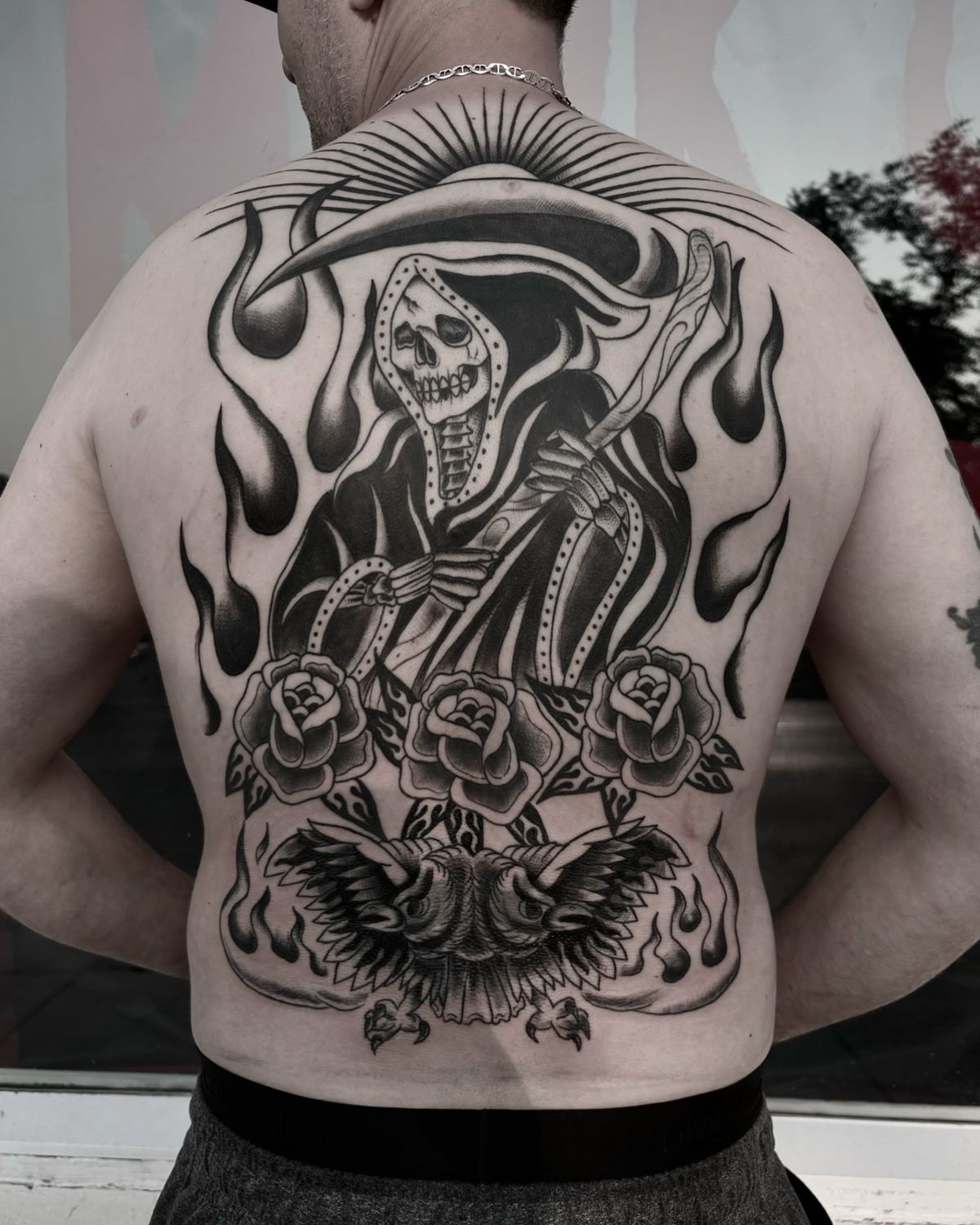 Custom large-scale blackwork back tattoo by M.INK Tattooing, Winnipeg — example of consultation-based design work.