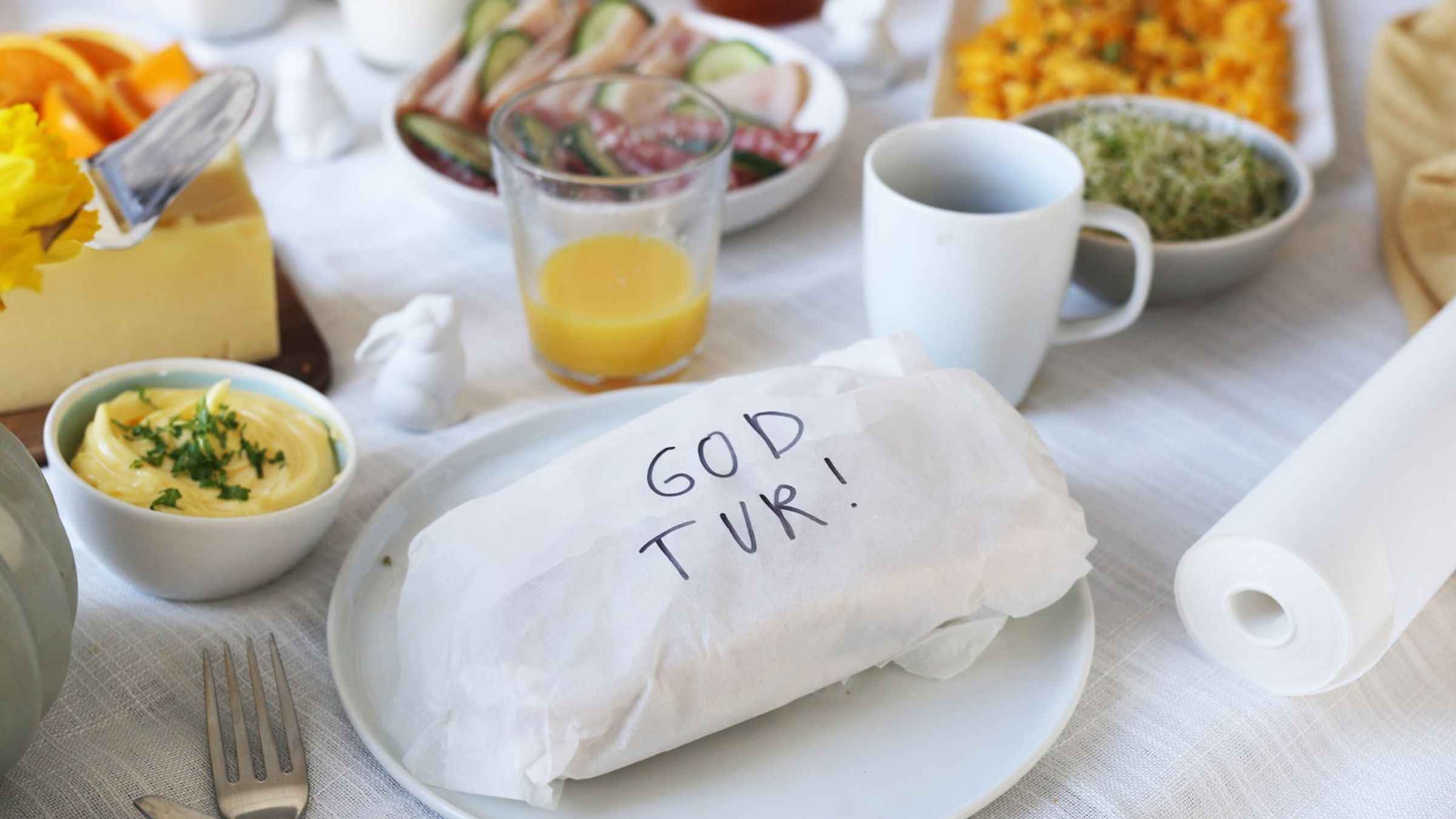 Smørgåspakke med "God Tur!" skrevet 