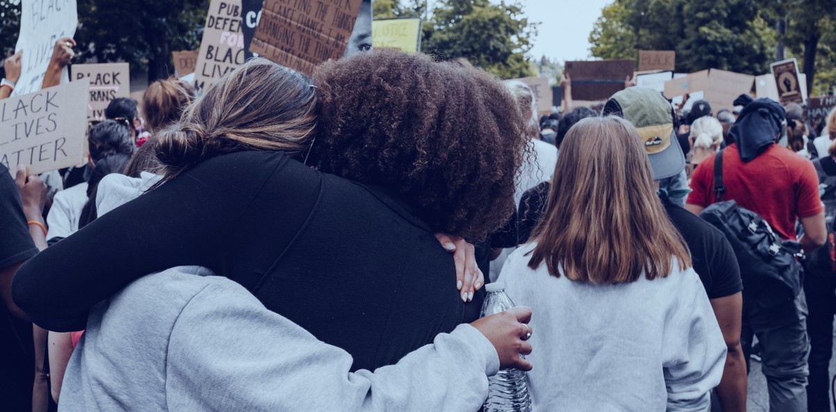 Black lives matter protesters embracing