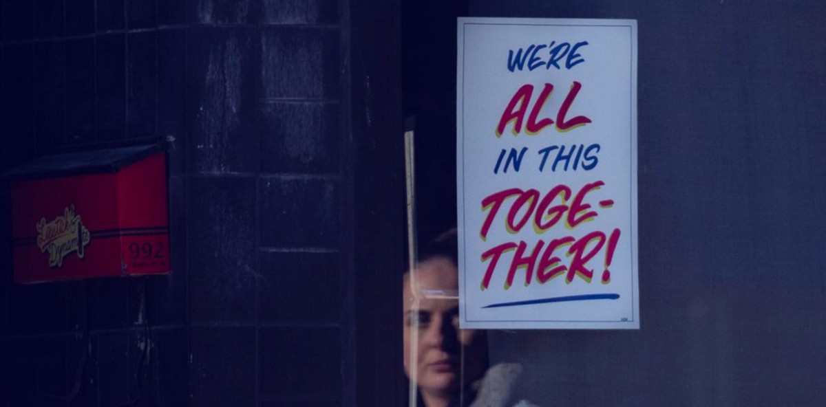 Sign that reads "we're all in this together!"