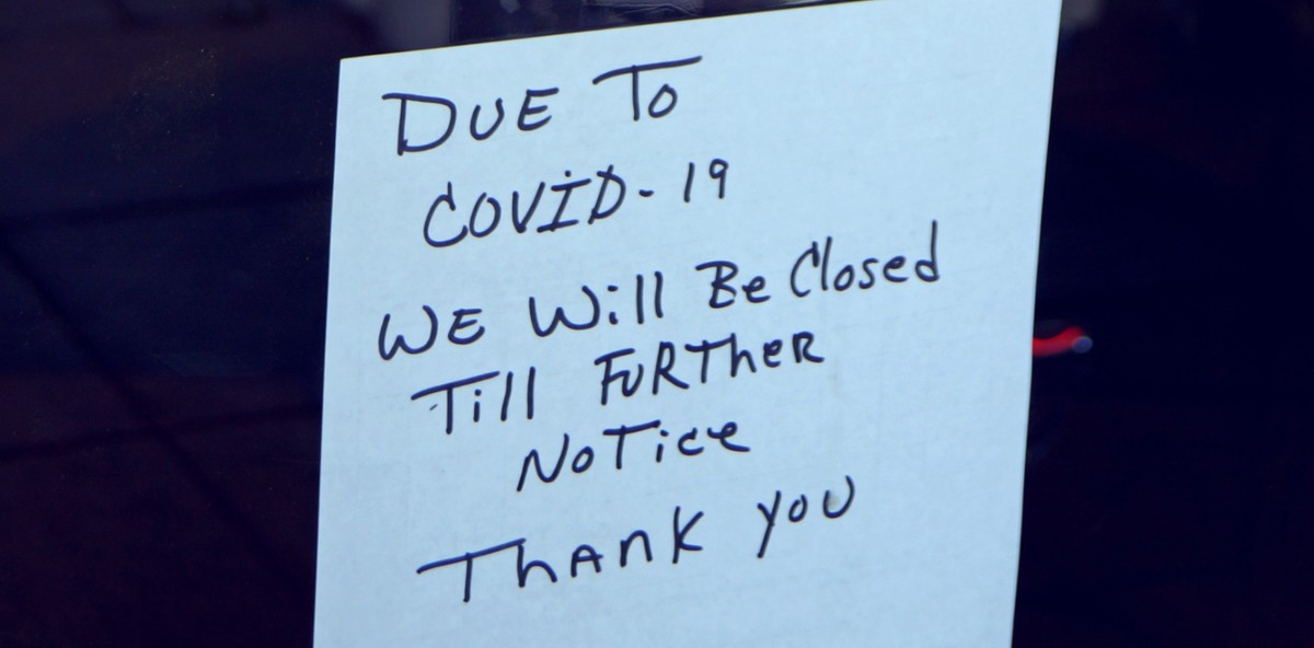 Sign on store reading "DUE TO COVID-19 WE WILL BE CLOSED TILL FURTHER NOTICE, THANK YOU"