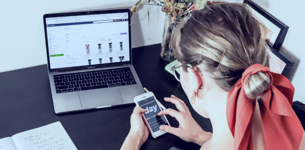 Person with a laptop & phone