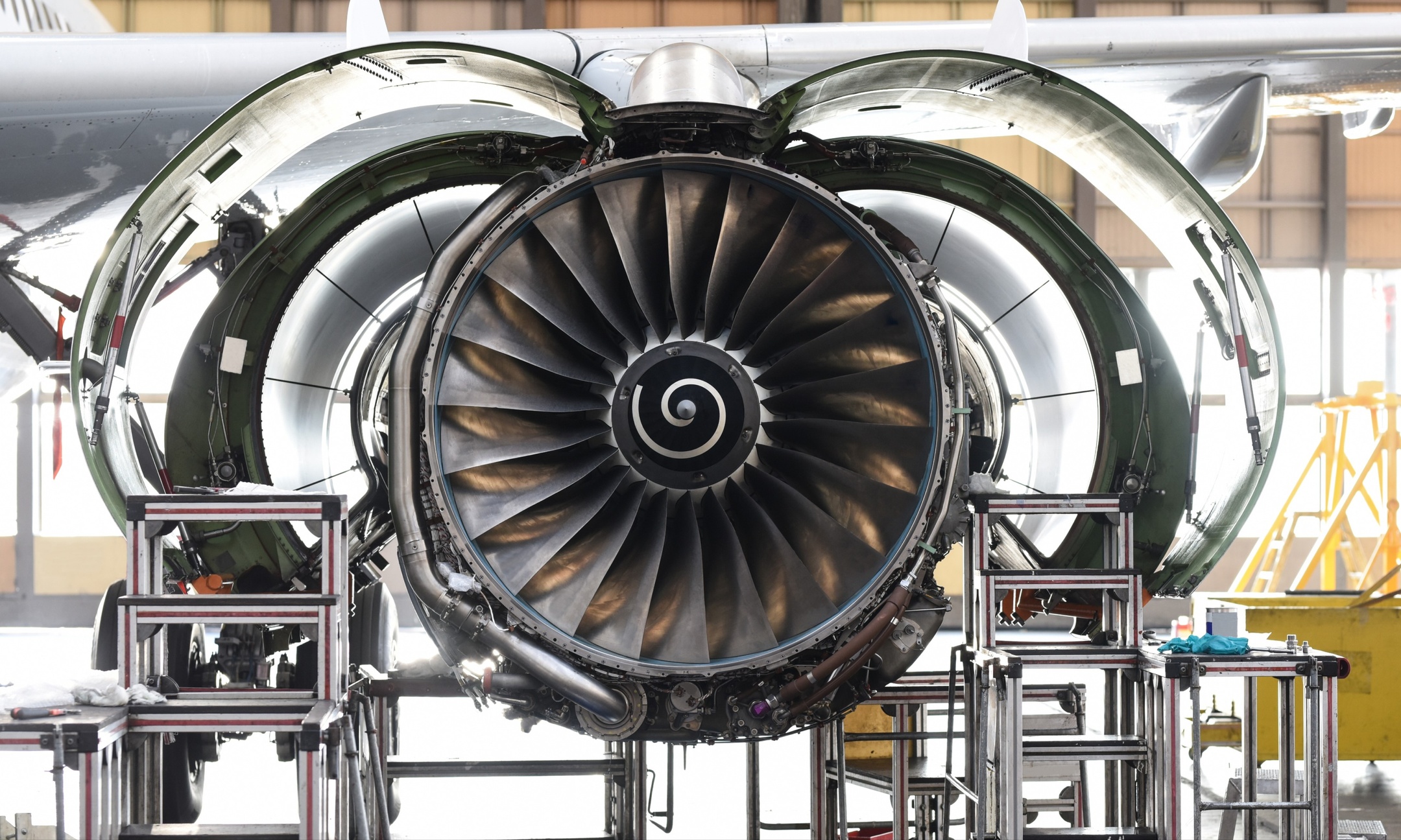 Aircraft engine with its cowling open in a manufacturing facility