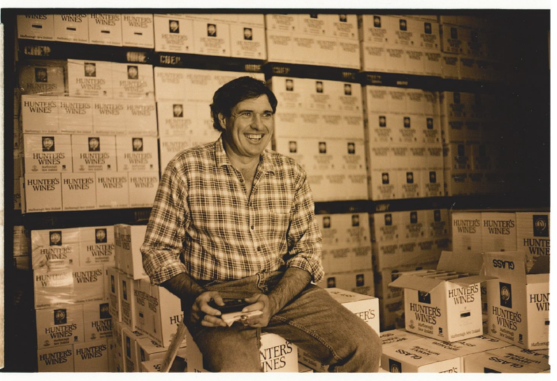 Peter Mac sitting on boxes of Hunter's Wines