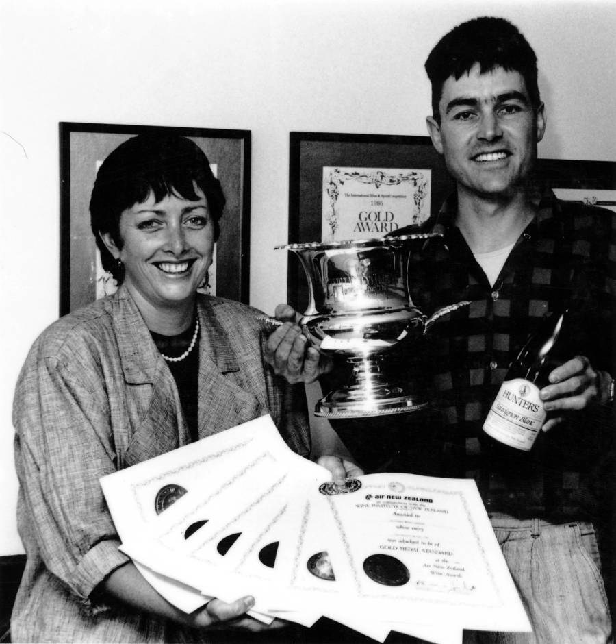 Jane Hunter and John Belshem posing with trophies, early 1990s