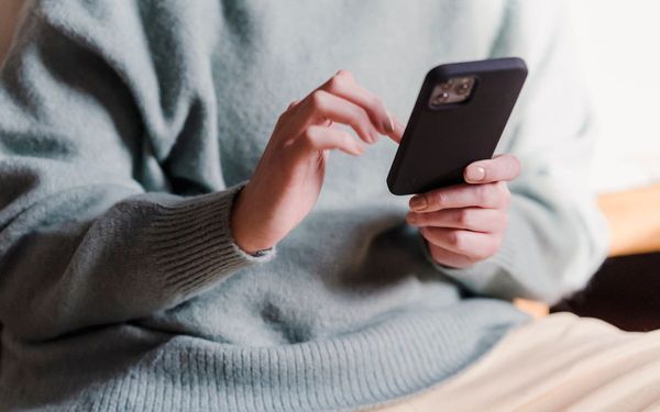 person with a smartphone in the hand