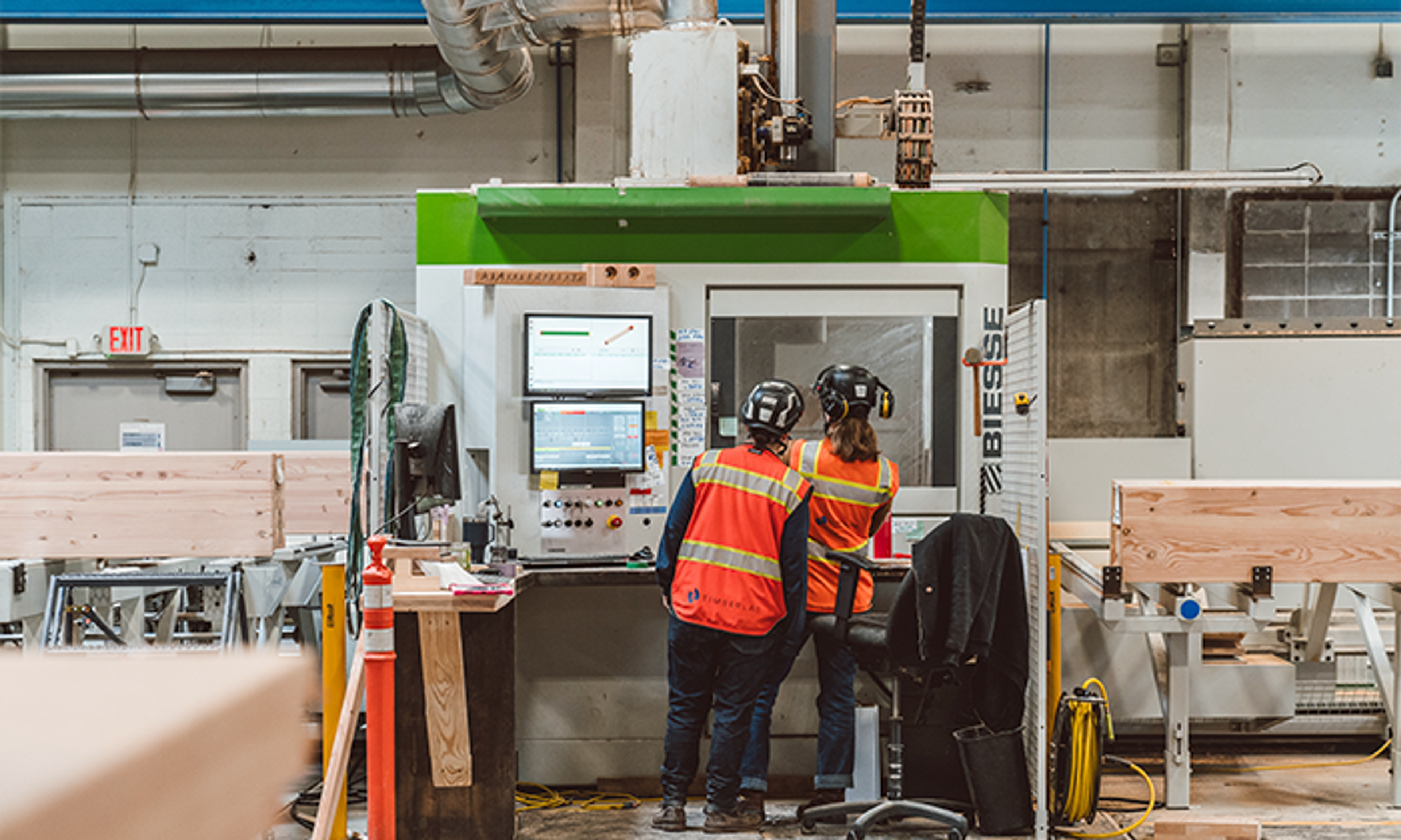 People looking into machinery