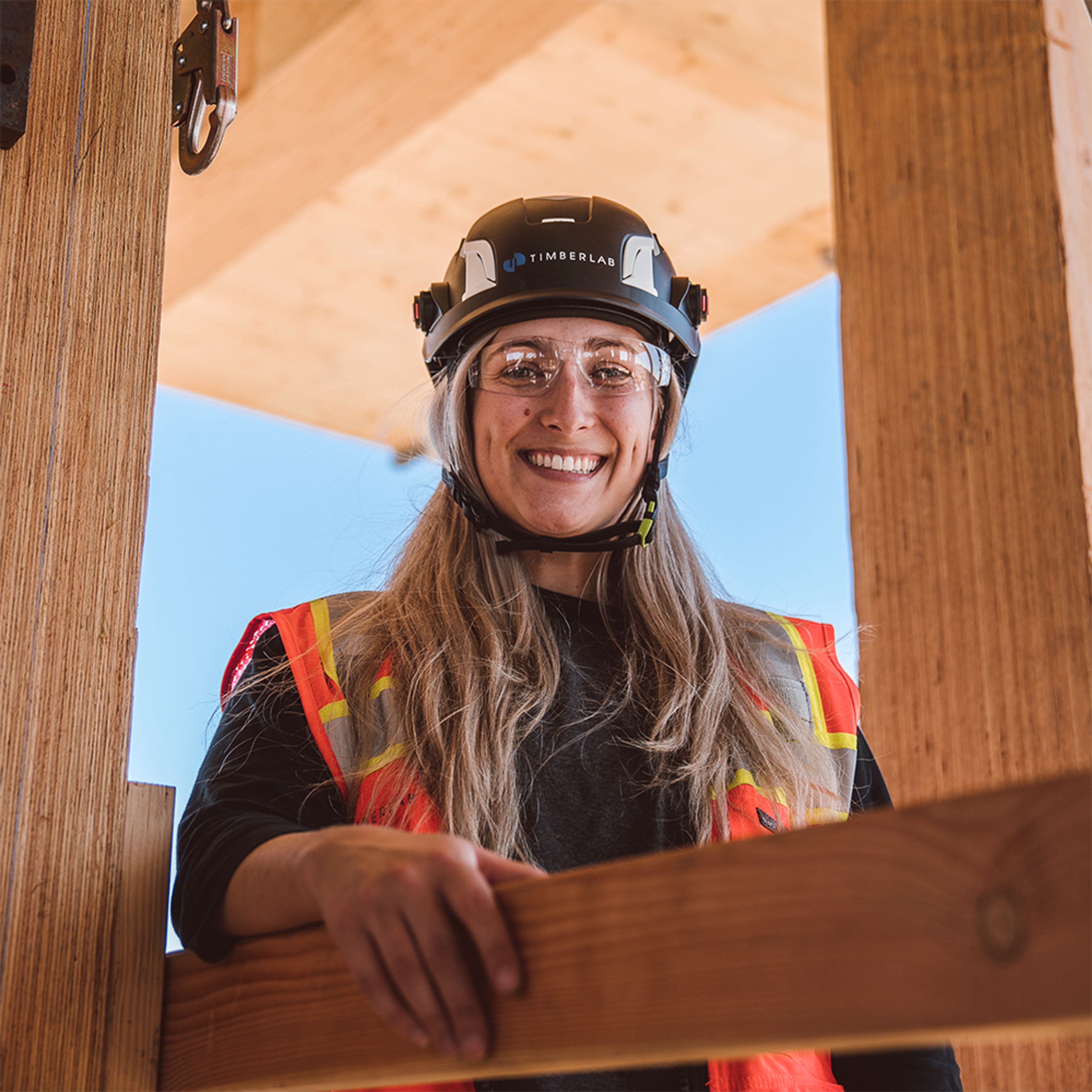 Timberlab employee on timber frame