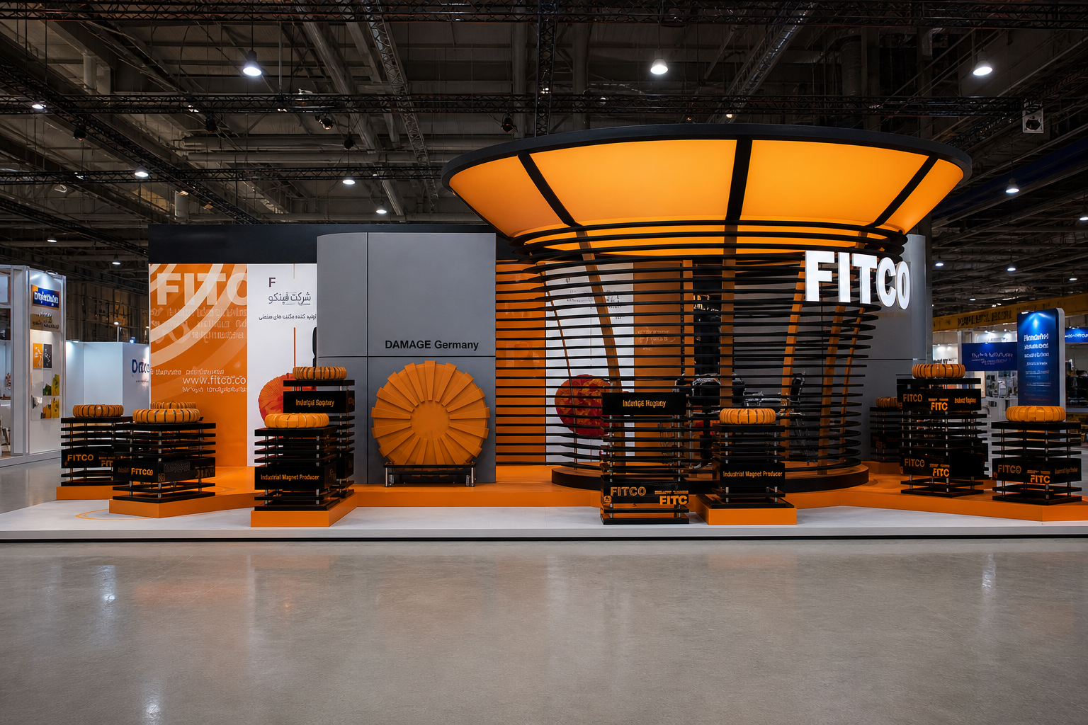Front view of the FITCO exhibition stand with a circular orange canopy, black structural slats and industrial product displays.
