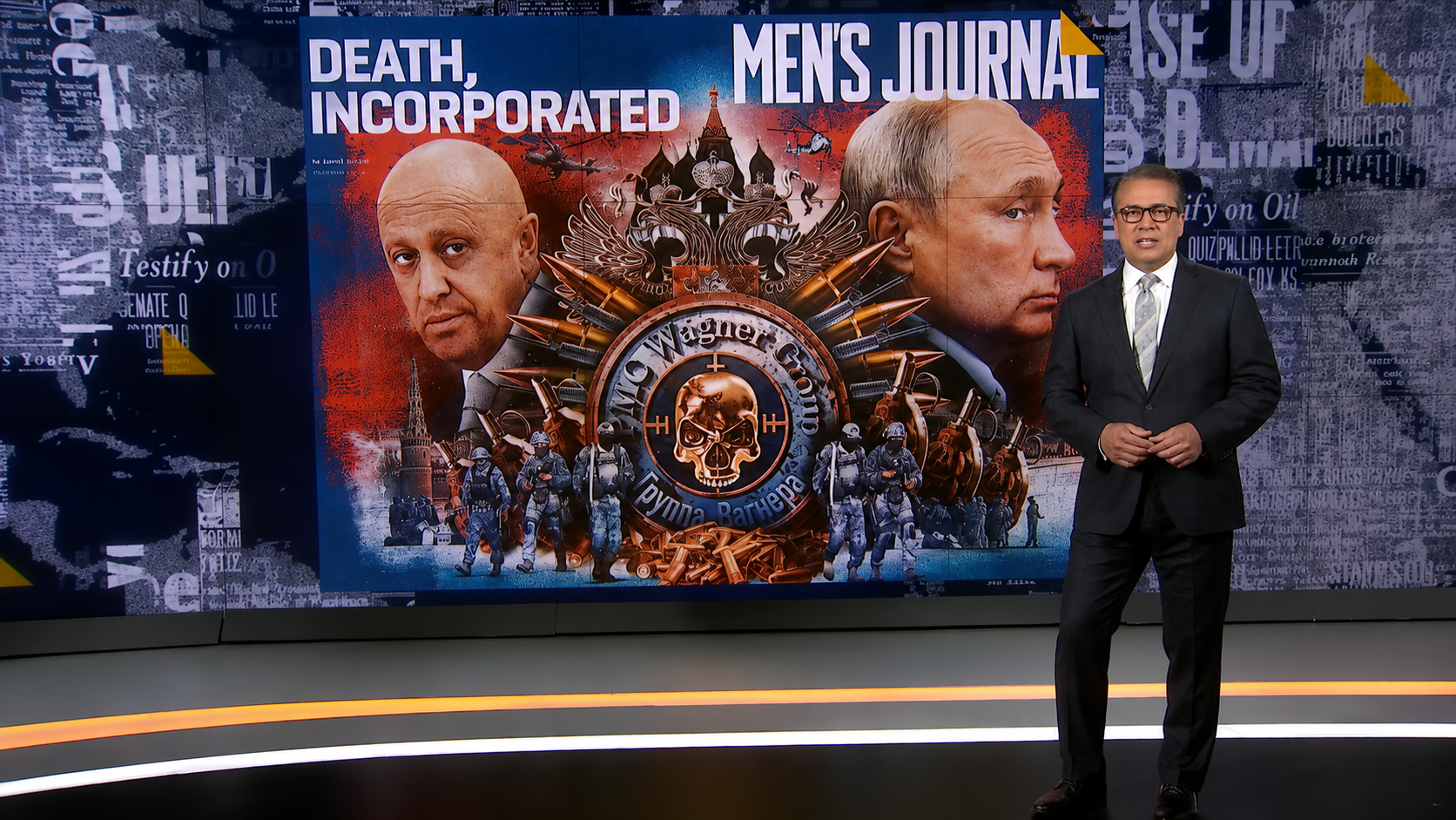 Television news studio with a male presenter standing beside a large screen displaying a Men’s Journal “Death, Incorporated” graphic featuring Vladimir Putin, a Wagner Group emblem, military imagery, and layered newspaper-inspired graphics.