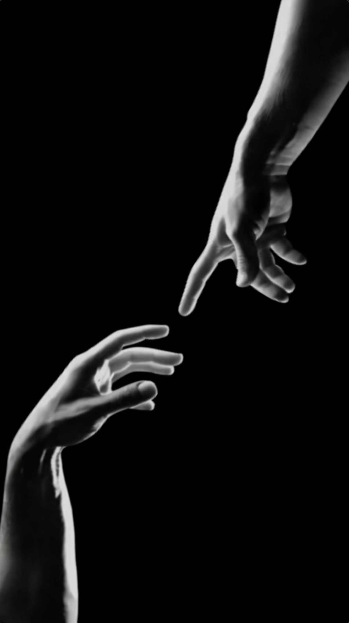 Experimental moving-image artwork showing two human hands emerging from a black background and slowly reaching toward one another, their fingertips approaching a moment of contact.