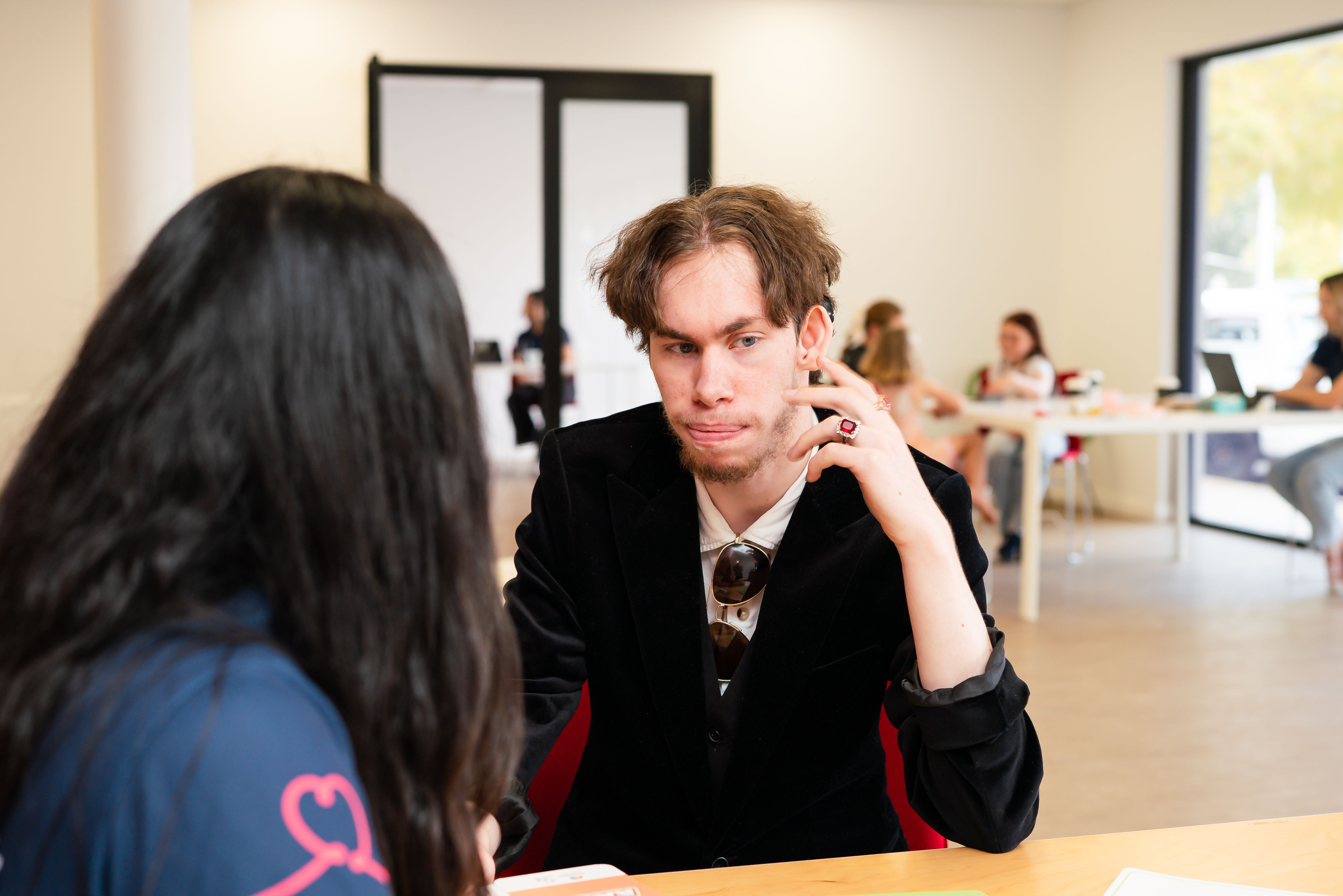 Man sitting at table talking to BlueRocket clinician