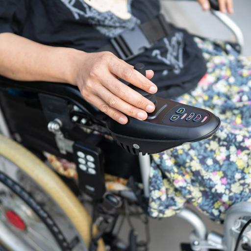 A lady using a powered wheelchair