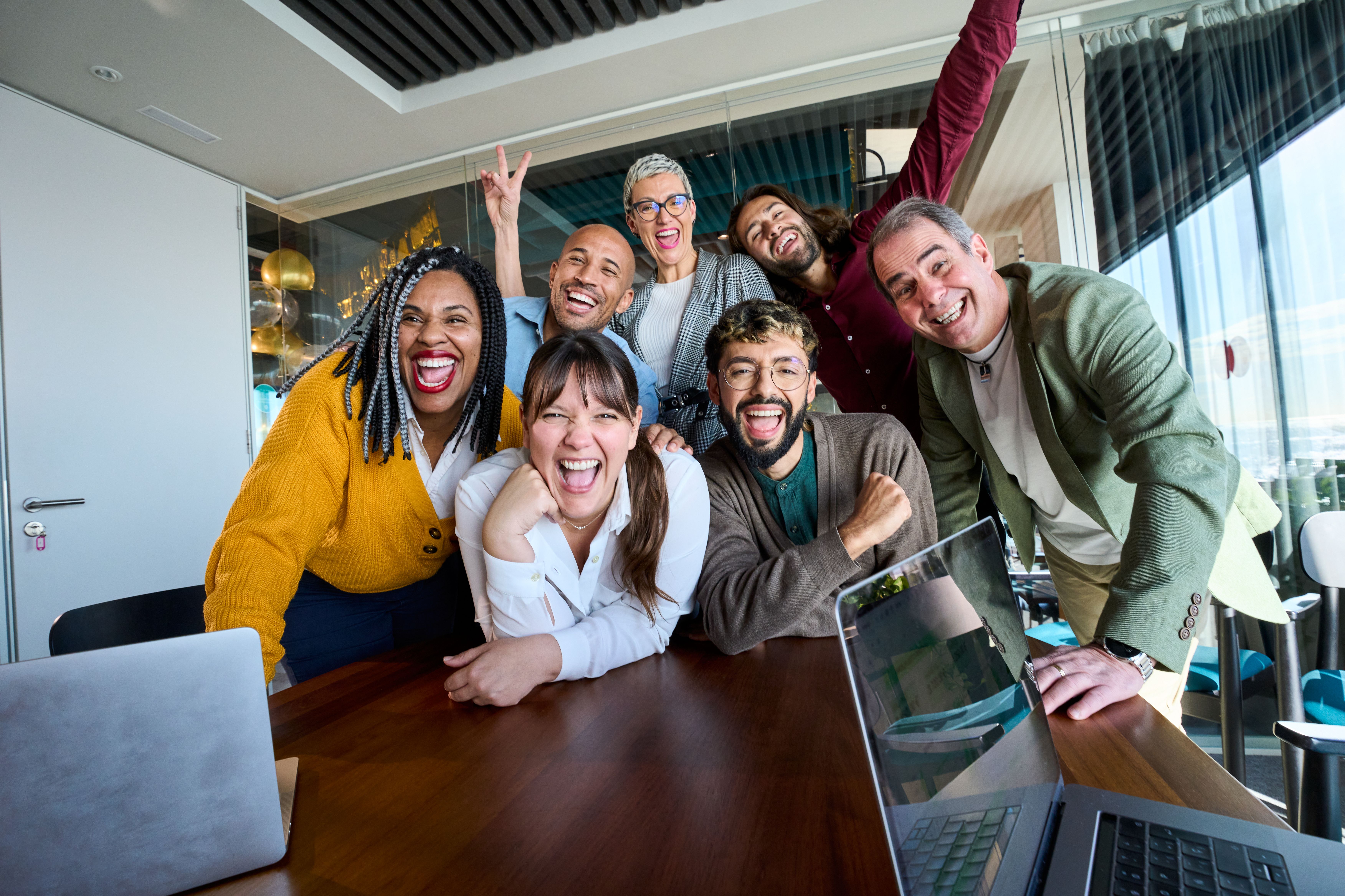 Happy group of co-workers laughing and enjoying each other's company