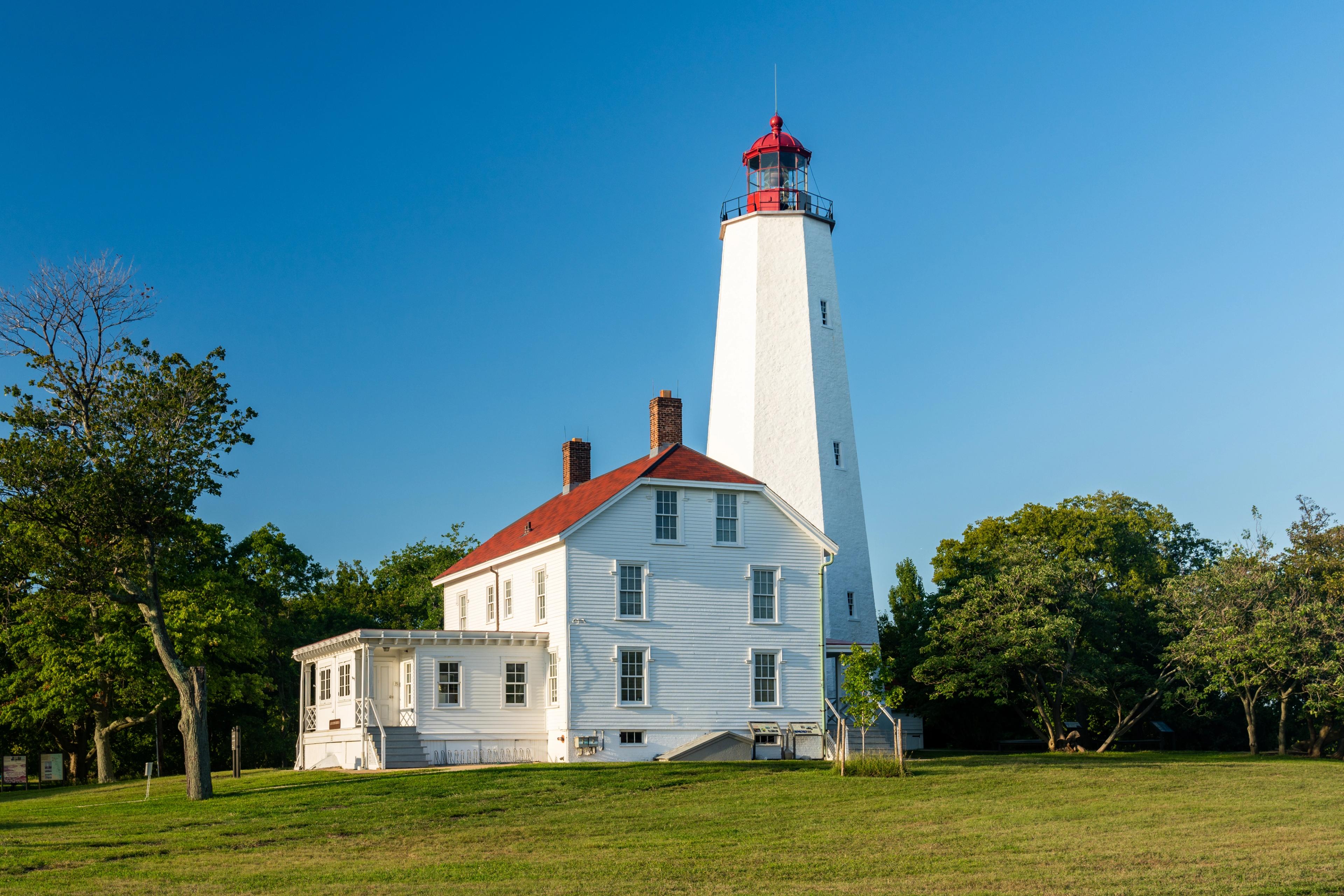 Exterior photograph of Sandy Hook Lighthouse.