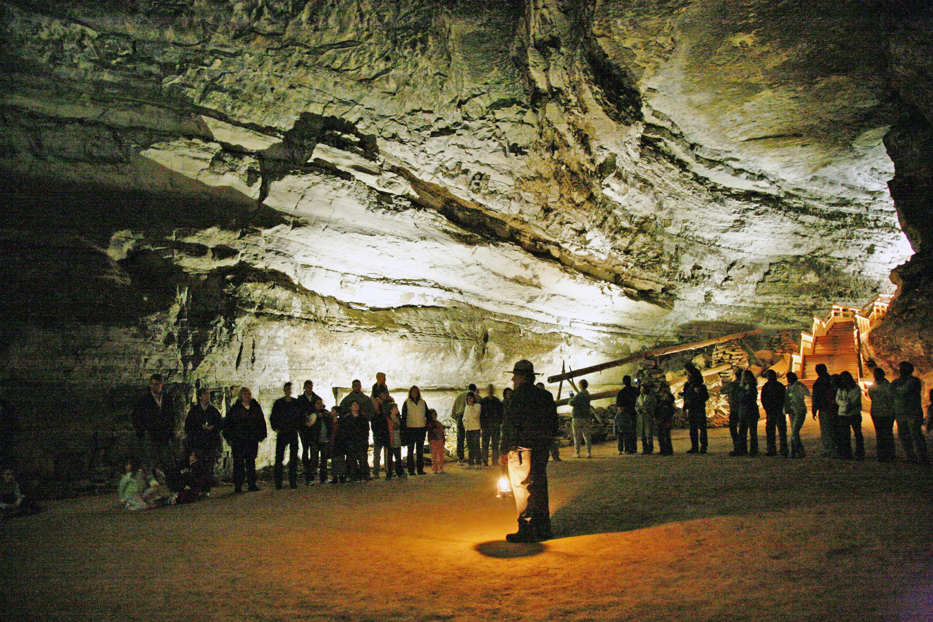 A national park ranger guiding tourists through Mammoth Cave.