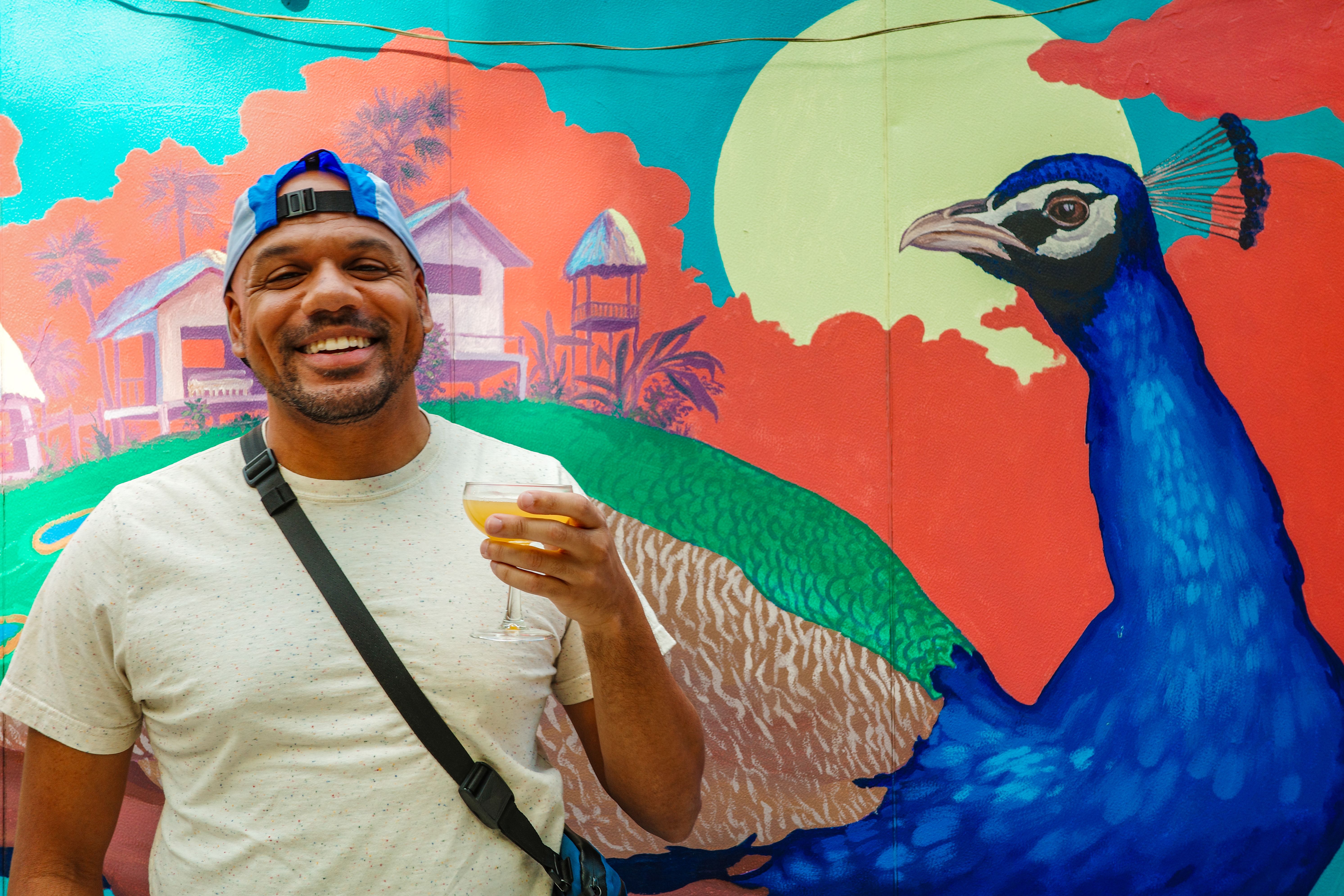 Ken with a bird mural