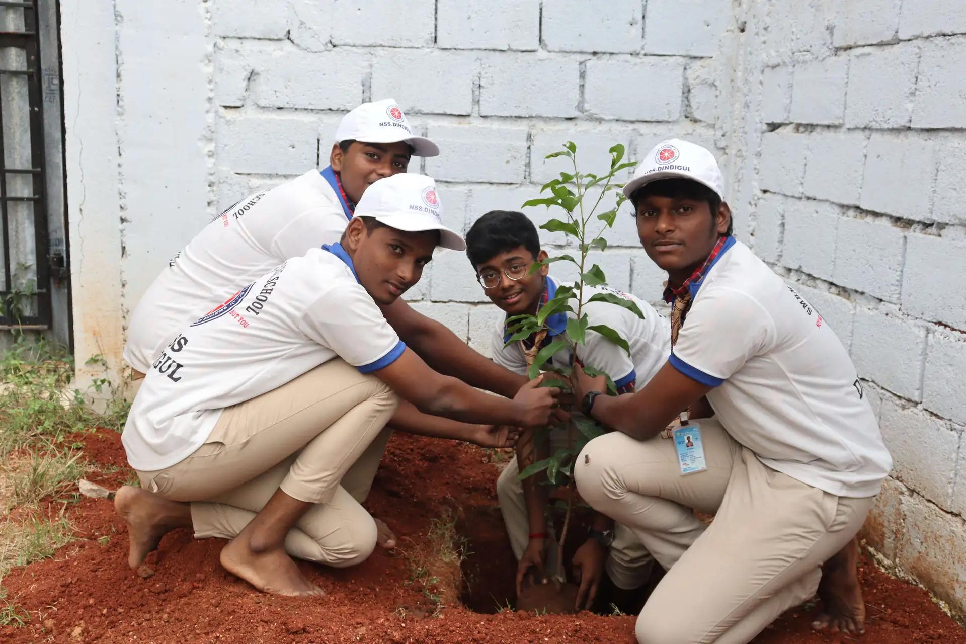 Students planting in a garden
