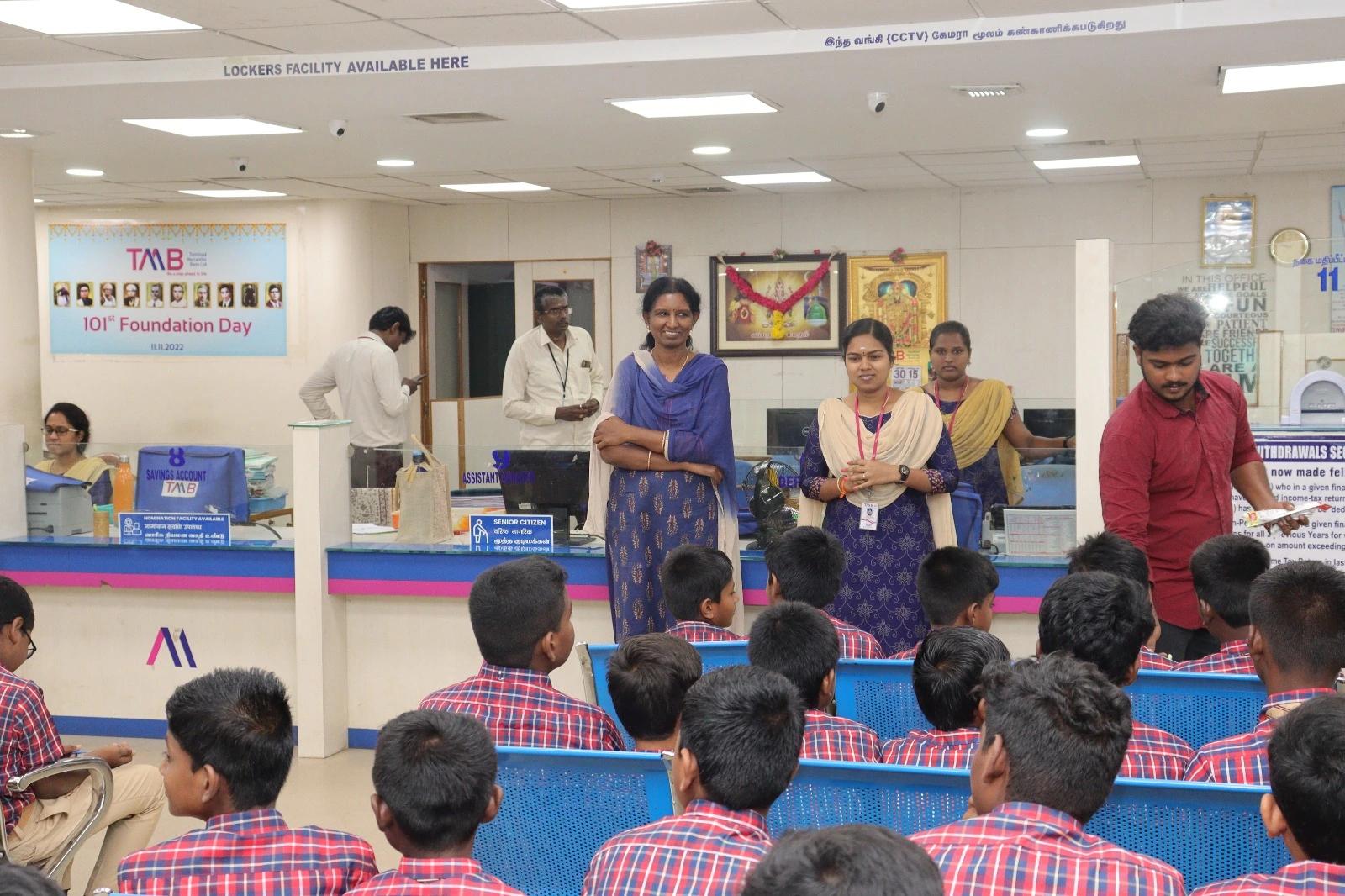 Students at TMB Bank participating in a hands-on banking activity.