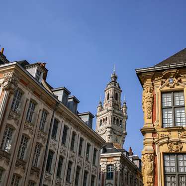 Some modern art outside the Métropole musée d' art moderne in Lille on a clear day.