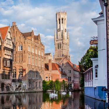 A view of the Bruges Belfry from a canal