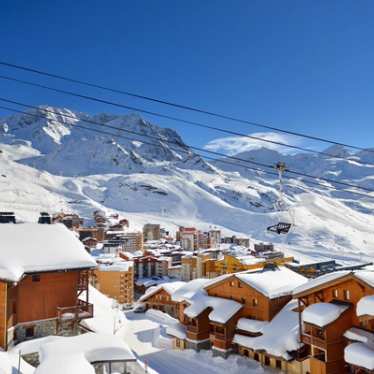 A view of the cable cars above a ski resort in the French Alps.