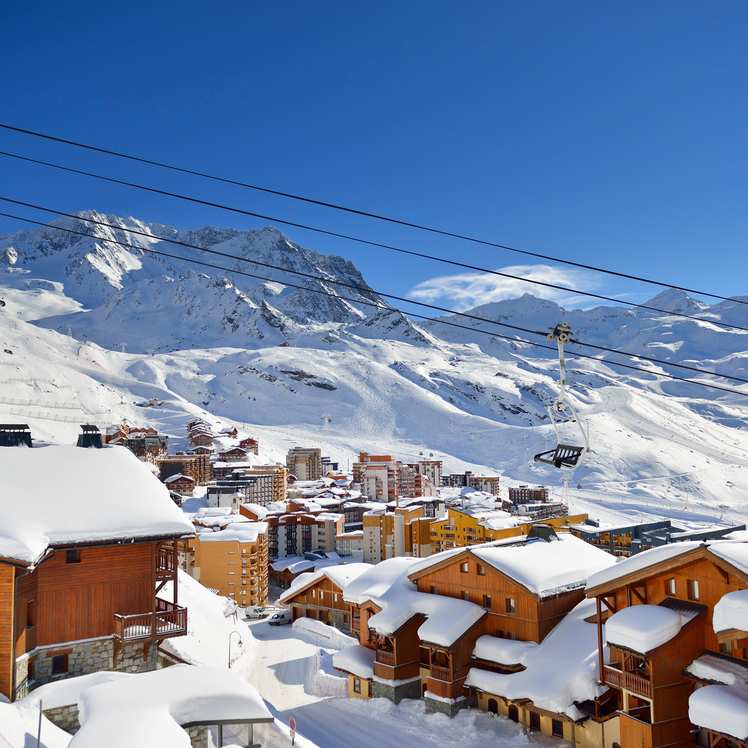 A view of the cable cars above a ski resort in the French Alps.