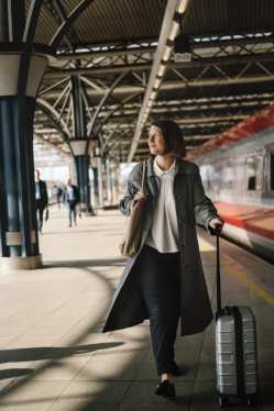 Woman on the platform with suitcase