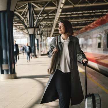 Woman on the platform with suitcase