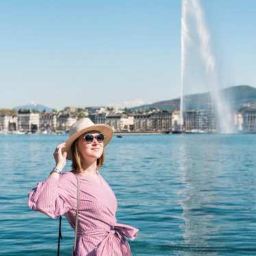 Lady holding her hat in Geneva, Switzerland