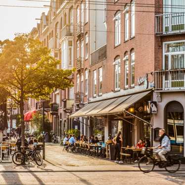 City cyclists in Amsterdam in the summer 