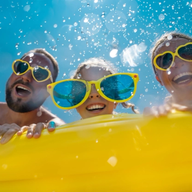 a family on a yellow rubber ring at Disney
